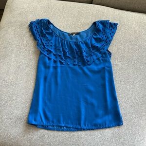 Royal blue blouse with cutout details at neck